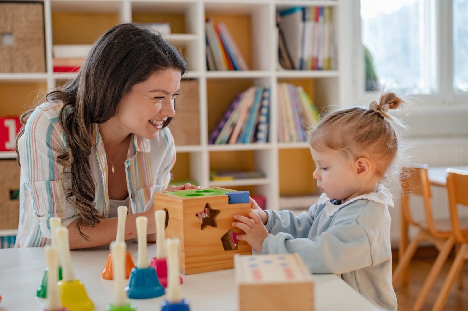 Toddler learning shapes with adult supervision