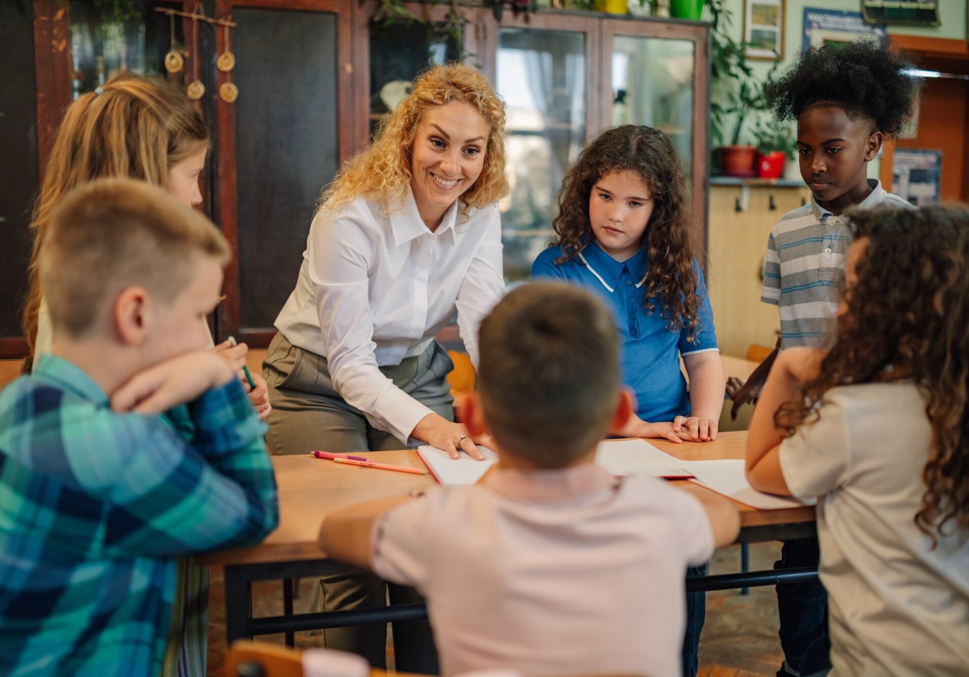 Classroom discussion with attentive young students